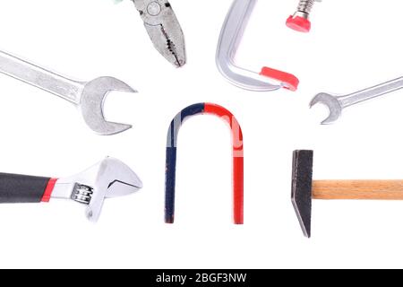 Composition of magnet and tools isolated on white Stock Photo