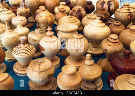 many vintage handcrafted wooden spinning top on a table Stock Photo