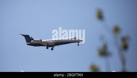 Biggin Hill,Kent,UK,21st April 2020,As Coronavirus Lockdown continues flights still land and take off  from London Biggin Hill Airport, an Embraer ERJ-135 prepares to land in glorious sunshine.Credit: Keith Larby/Alamy Live News Stock Photo