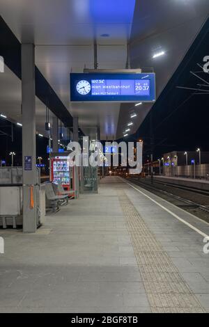 Feb 6, 2020 - Attnang Puchheim, Austria: Railway station platform with info upcoming train to Vienna in the evening Stock Photo