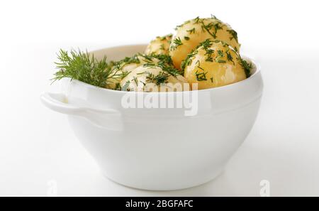 Bowl with boiled young potatoes, isolated on white background Stock ...