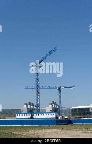 construction cranes on addenbrookes science park biomedical campus Cambridge MRC LMB laboratory of molecular biology in background Stock Photo