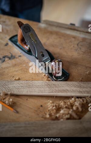 A plane on a carpenters workbench. Stock Photo