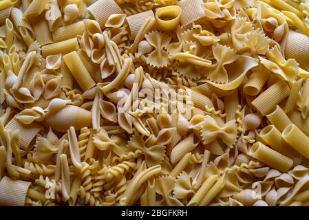 Variety of types and shapes of dry Italian short cut pasta Stock Photo