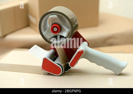 Packaging parcels with dispenser close-up Stock Photo