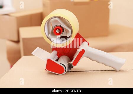 Packaging parcels with dispenser close-up Stock Photo