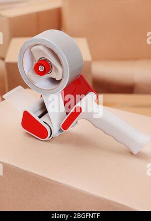 Packaging parcels with dispenser close-up Stock Photo