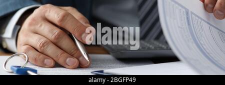 Man in presentable grey suit Stock Photo