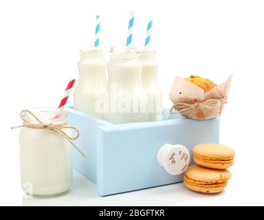 Milk in bottles with paper straws isolated on white Stock Photo