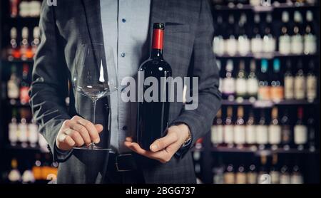 Sommelier man is preparing for tasting of red wine in restaurant Stock Photo