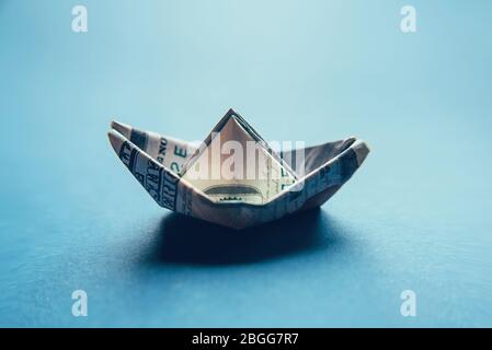 100 dollar bill in the shape of a ship. Stock Photo