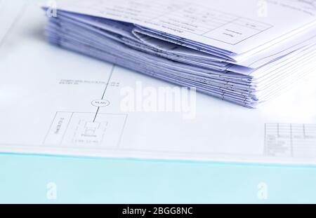 Stack Folding drawings on a blue background. Top view. Flat lay. Copy space Stock Photo