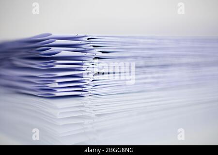 Stack Folding drawings on a blue background. Copy space Stock Photo