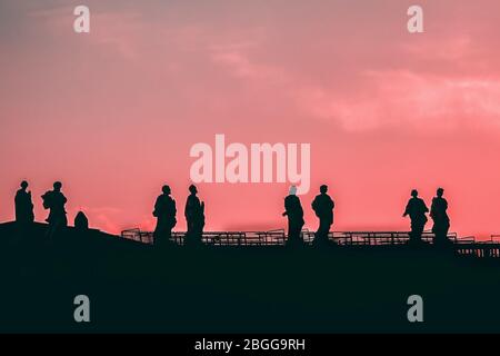 Sculptures of saints in Vatican. Silhouette on the pink sky background Stock Photo