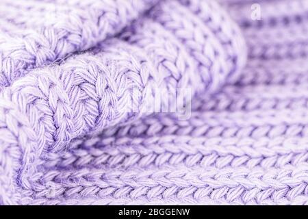 Woolen knitted pattern. Knitted background. Light purple or lavender color Stock Photo