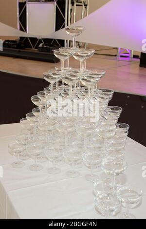 champagne glasses standing in pyramid tower at the party Stock Photo