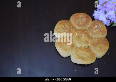 Whole Wheat buns with wooden background Stock Photo