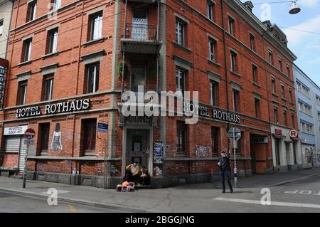 Zürich/Switzerland: The 'Langstrasse' ist empty due to CoVid19 Virus Lockdown - the hotel Rothaus at Langstrasse closed and poor strandet people sitti Stock Photo