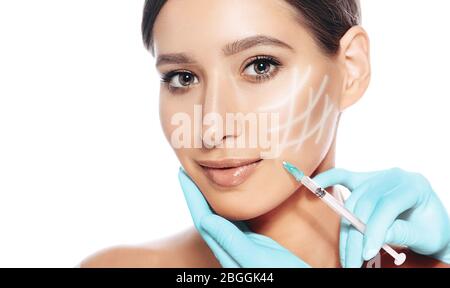 Woman face with arrows on face, rejuvenation skin. Injections Botulinum toxin for remove wrinkle Stock Photo