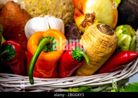 Healthy roots and vegetables in wicker basket Stock Photo