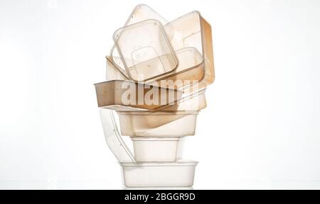 A pile of used plastic takeaway boxes on a white background Stock Photo