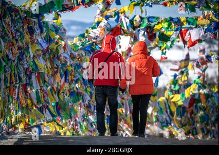 Lovers are walking accross buddist wishes at the Datsan 'Rinpoche Bagsha' monstery in Ulan Ude, Siberia, Russia Stock Photo