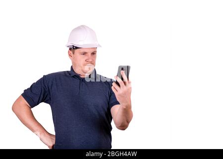 white male engineer in a white hard hat Stock Photo