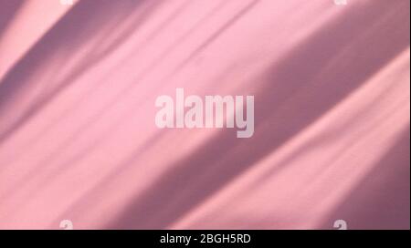 Diagonal shadows on pastel texture pink paper. Abstract backgorund. Stock photo. Stock Photo
