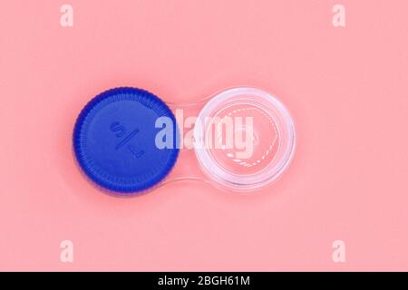 Contact lens case on pink pastel background . Stock Photo