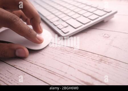 Close up of person hand using computer mouse. Stock Photo