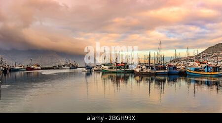 Cape Town, South Africa - May 13, 2015: View at the fishing boats at the Hout Bay near Cape Town in South Africa. Stock Photo