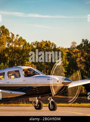 A Piper Archer III taxis by at the Habersham County Airport. Stock Photo