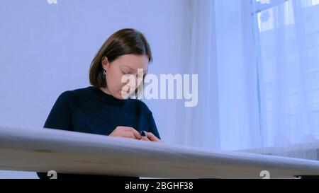 Designer making handmade brooch Stock Photo