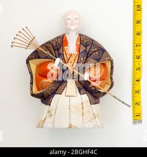 GOMEL, BELARUS - APRIL 20, 2020: The Antique Kimekomi Japanese doll old man Jo depicting a Noh play, 'The Old Couple from Takasago'. Stock Photo