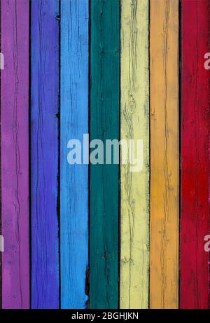 vertical textured background from old wooden planks painted in different colors of the rainbow Stock Photo