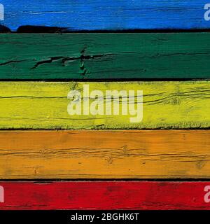 square bright textured background from old wood cracked planks painted in different colors of the rainbow Stock Photo