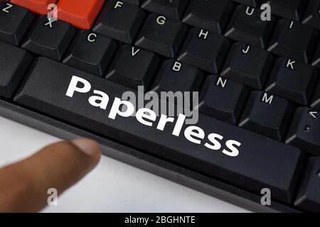 Paperless isolated on laptop keyboard background. Stock Photo