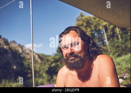 Portrait of a bearded male tourist on a halt Stock Photo