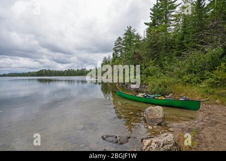 Canoe Ready to Head out to the Wilds on Meadows Lake in Quetico Provincial park in Ontario Stock Photo