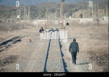 San Antonio de los Cobres, Salta, Argentina - August 31 2012: View of the tracks of the tren a las nubes and local people of the high plateaux Stock Photo