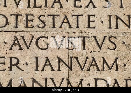 Latin ancient language. Inscription from the famous Res Gestae (1st century AD), with the word Augustus in the center Stock Photo