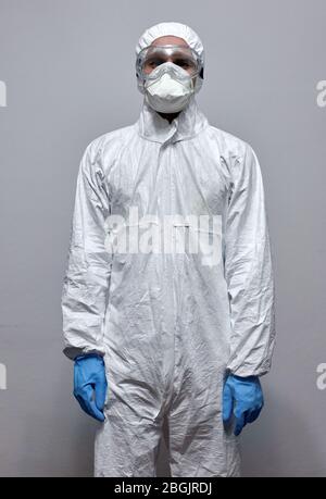 Healthcare worker, medic or paramedic in protective overall gear Stock Photo