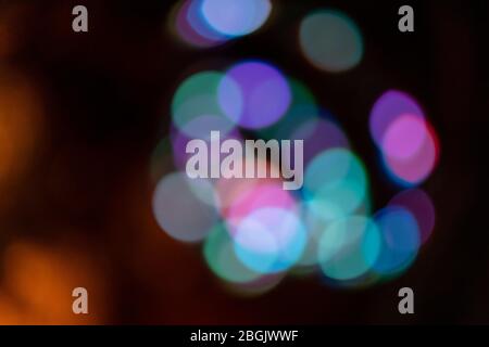 Colorful bokeh lights at night with a warm background Stock Photo