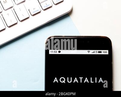 In this photo illustration an Aquatalia logo seen displayed on a