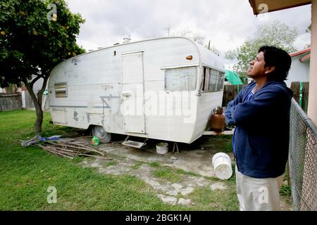 April 11, 2006, Huron, California, USA: ENRIQUE (not his real name), is a 35 year old undocumented farmworker from Mexico. To reach California, he paid a coyote $1200 and endured three straight days walking in the Arizona desert. His home, which was donated, is an overcrowded and moldy trailer. He is one of the lucky immigrants- others in town have to pay up to $400 a month for similar accommodations, with no running water or bathroom facilities. Although it is damp and cramped, he prefers the privacy over living in a shared room at the labor camps in town. About 39 percent of Huron's resident Stock Photo