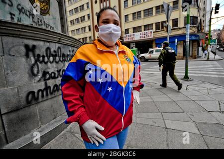 April 21, 2020, La Paz, LA PAZ, Bolivia: Young Venezuelan refugee in Bolivia. The population of young people who arrived from Venezuela in mid-2019, the majority selling sweets on the streets, cleaning windshields or begging for limozna, is among the most unprotected against the confinement measures issued in Bolivia. Meanwhile, the family economies of the population that does not work for some state structure are collapsing: freelancers, casual workers, as well as a large part of the private sector are going bankrupt. Credit: ZUMA Press, Inc./Alamy Live News Stock Photo