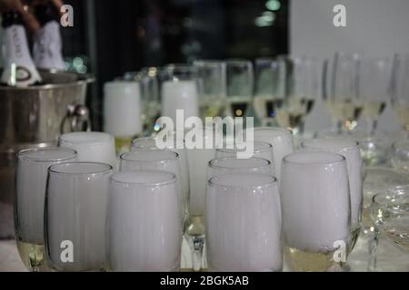 Bals / Romania / December 27, 2018: Close up of a group of champagne glasses full with drinks and foam Stock Photo
