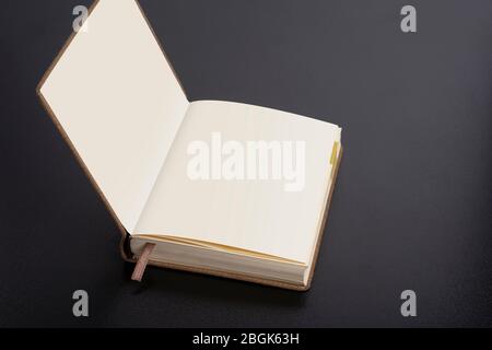 Daily planner notebook with smart object pages on dark black background Stock Photo