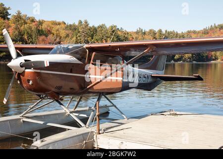 Float plane has landed on an upstate New York Long Lake. Stock Photo