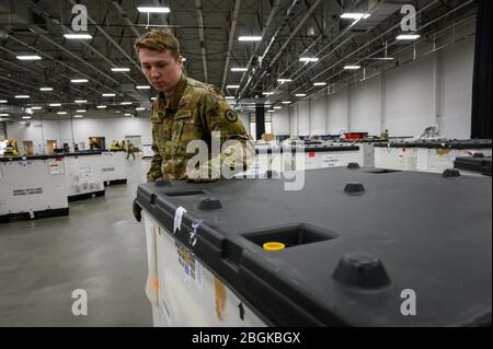 New Jersey National Guard Soldiers with Joint Task-Force 57 (JTF 57) conduct inventory at the Meadowlands Exposition Center, Secaucus, N.J., March 28, 2020. JTF-57 assisted with the set up of Federal Medical Stations in support of the COVID-19 relief effort. Stock Photo